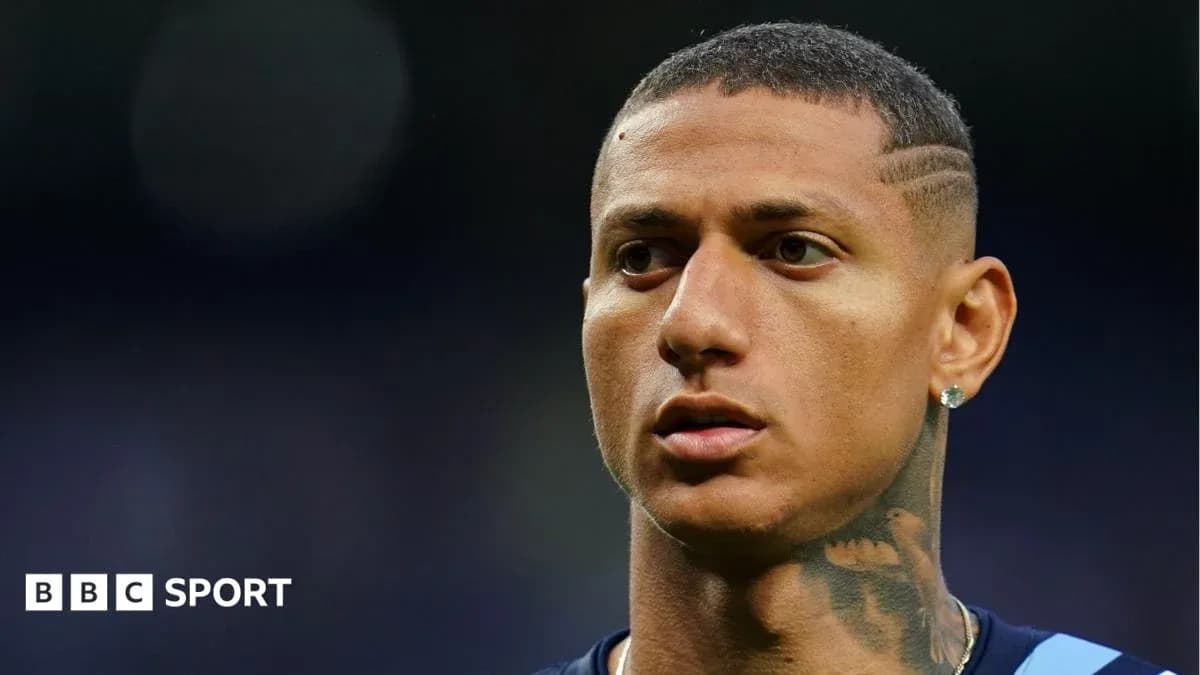 Player with short hair and earring in stadium
