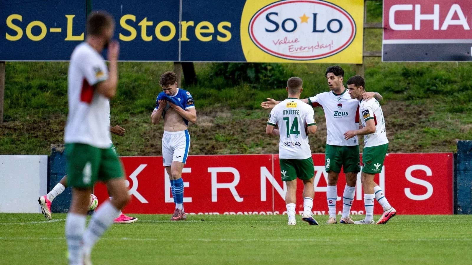 Players celebrating a goal during football match Players celebrating a goal during football match