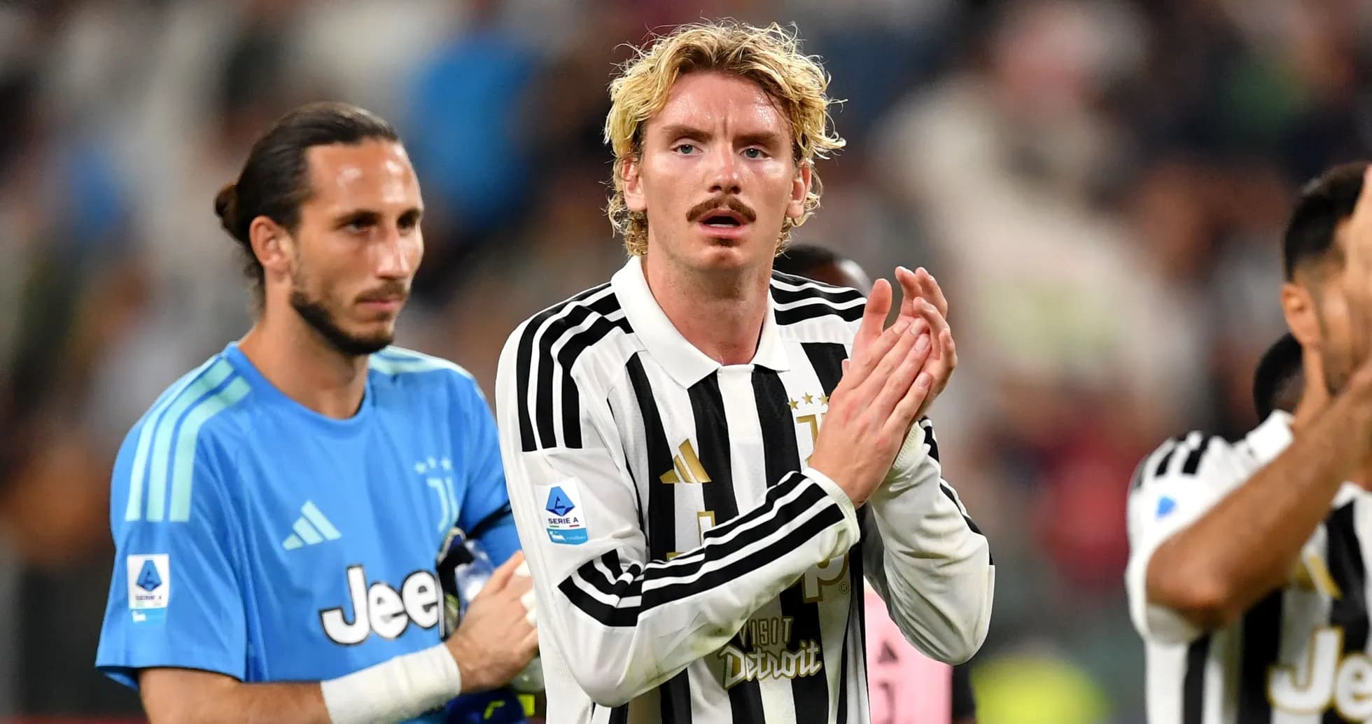 Juventus players applauding fans after the match