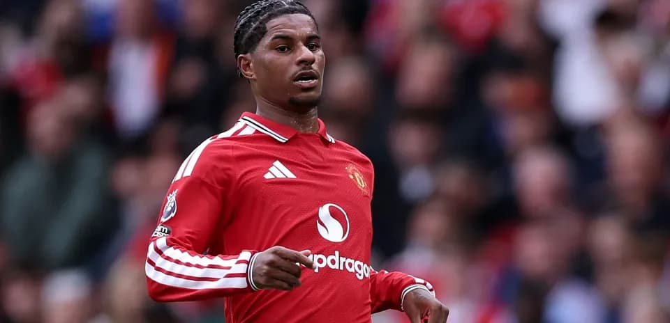 Player in red Manchester United jersey during match