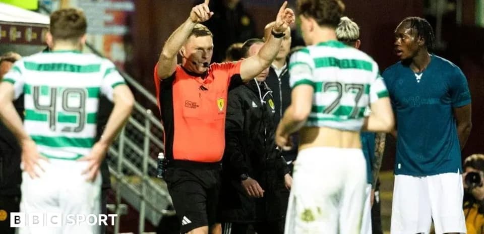 Referee giving instructions to players during match