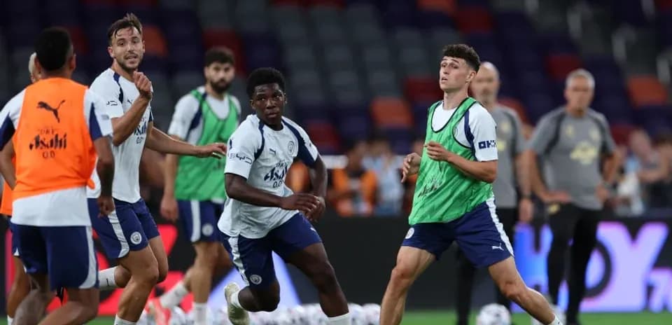 Players practicing during training session on pitch
