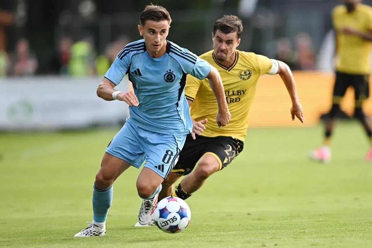 Player dribbling the ball in UEFA match