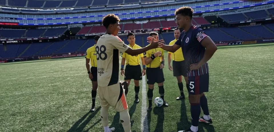 Players shaking hands before match at Gillette Stadium