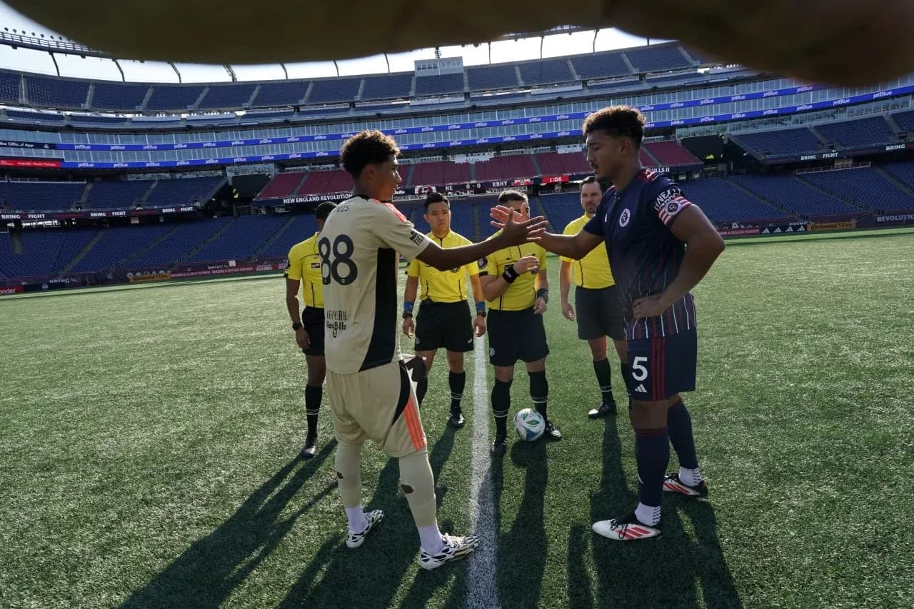 Players shaking hands before match at Gillette Stadium