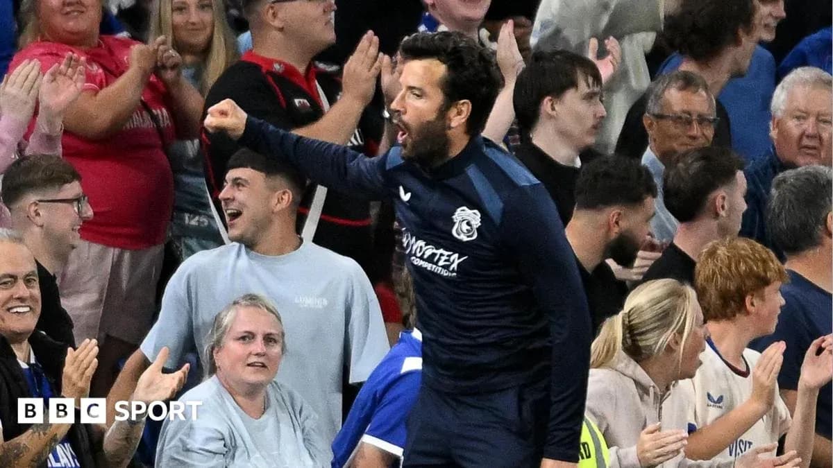 Player celebrating with fans in stadium crowd