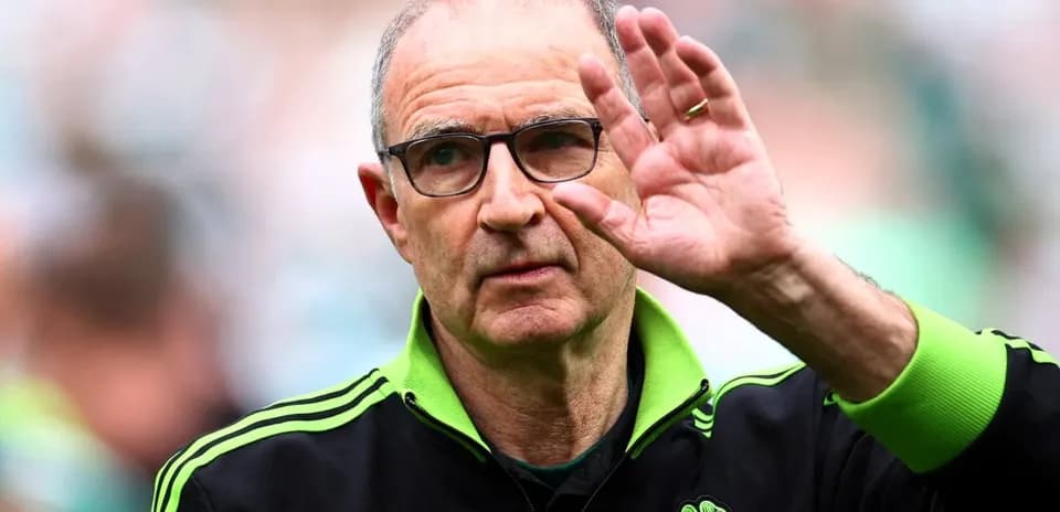 Coach waving to fans during match