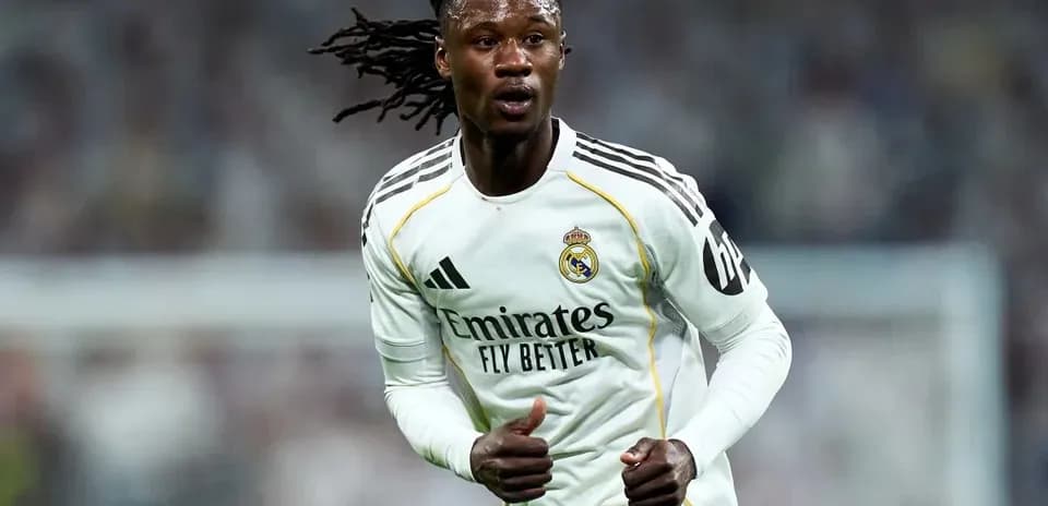 Player running during a match in Real Madrid kit