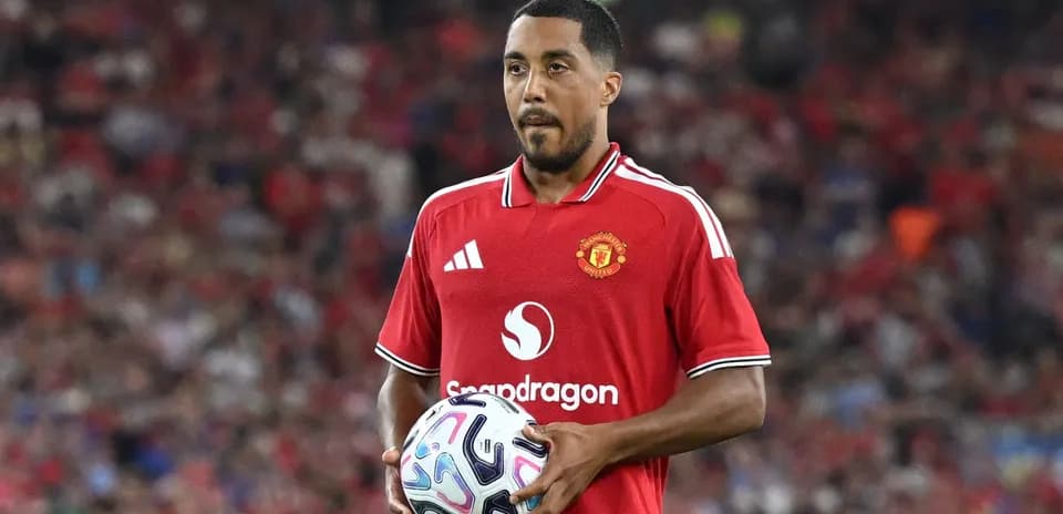 Player holding a soccer ball during match