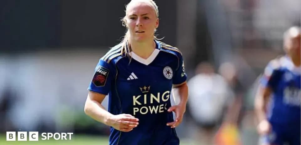 Female player running in blue Leicester City kit