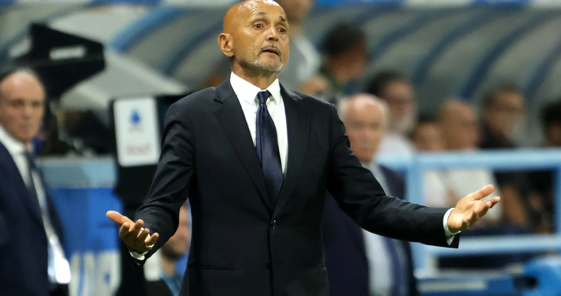 Coach gesturing during a match from the sidelines