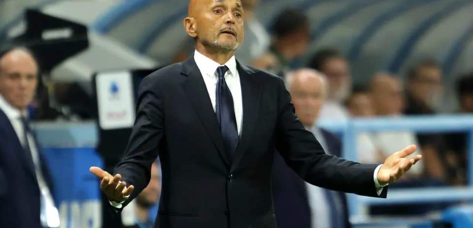 Coach gesturing during a match from the sidelines