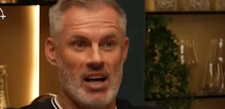 Man speaking during a discussion in a casual setting