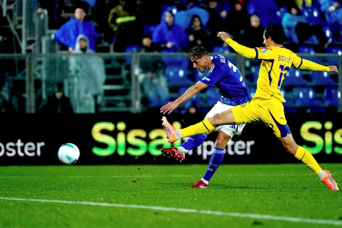 Player shooting on goal during Hellas Verona match