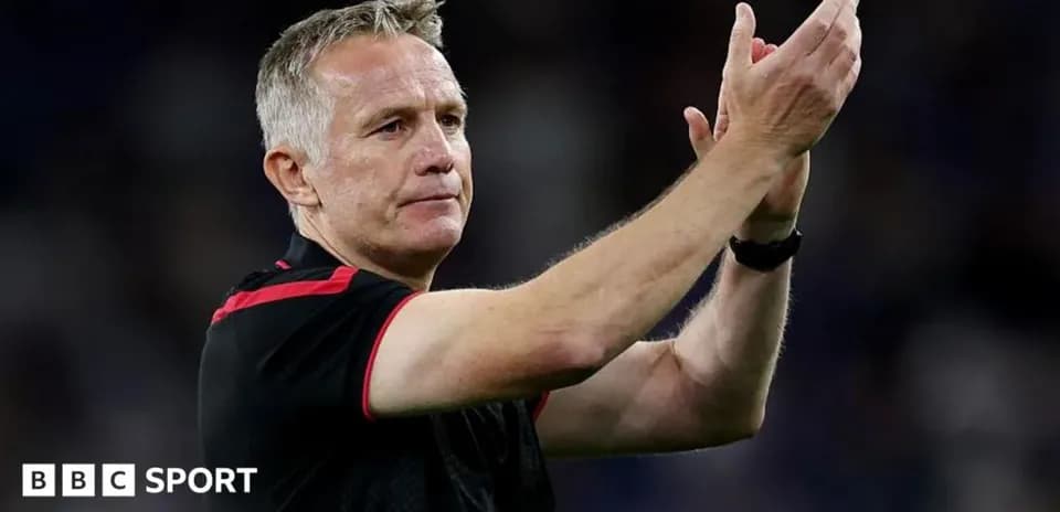 Coach applauding fans after the match