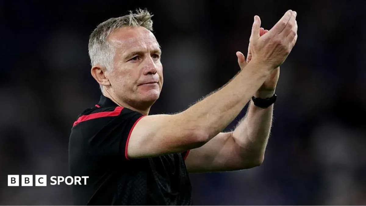Coach applauding fans after the match
