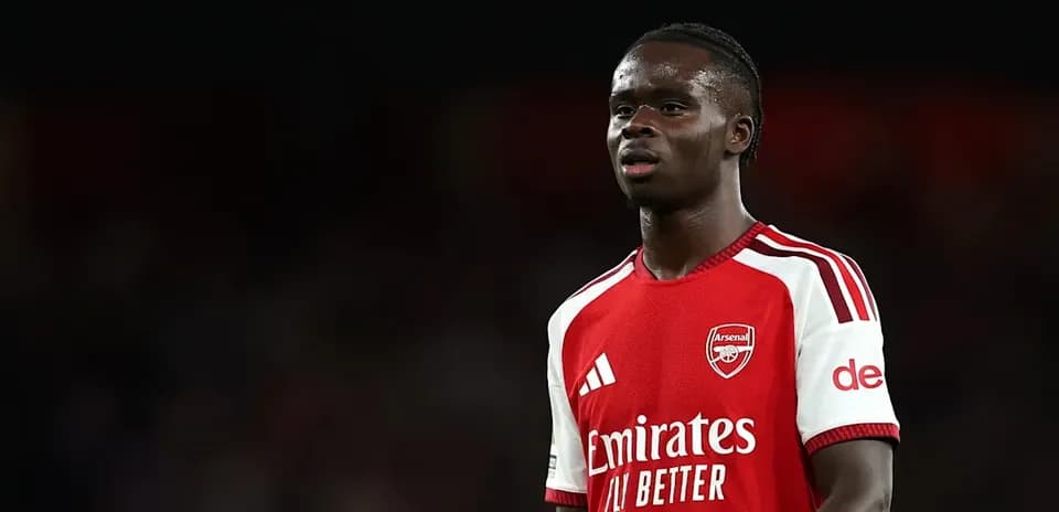 Player in Arsenal kit during match at stadium