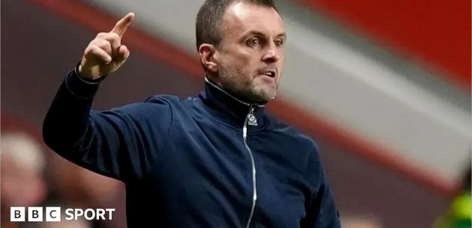 Manager gesturing during a football match
