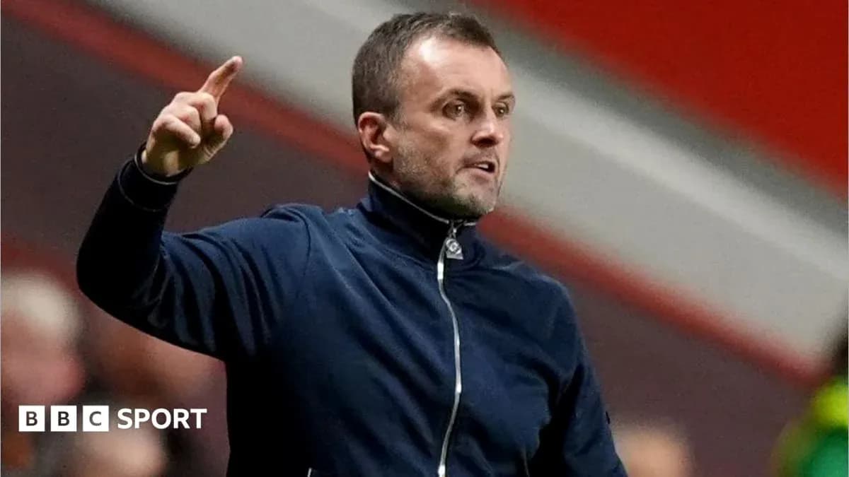 Manager gesturing during a football match