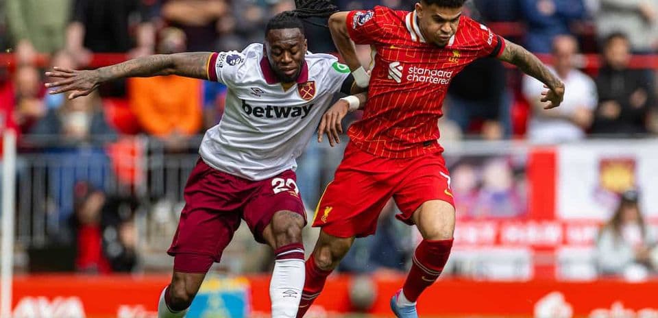 Liverpool and West Ham players competing for the ball