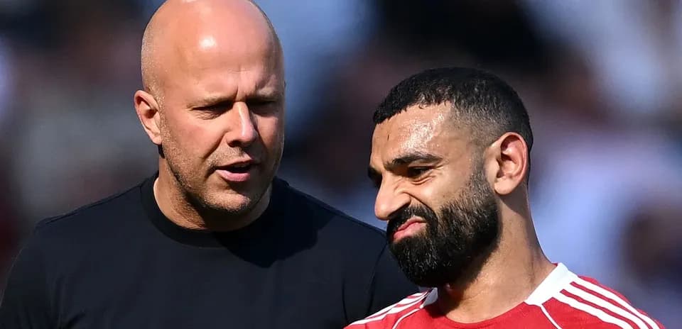 Two men discussing on the pitch after match