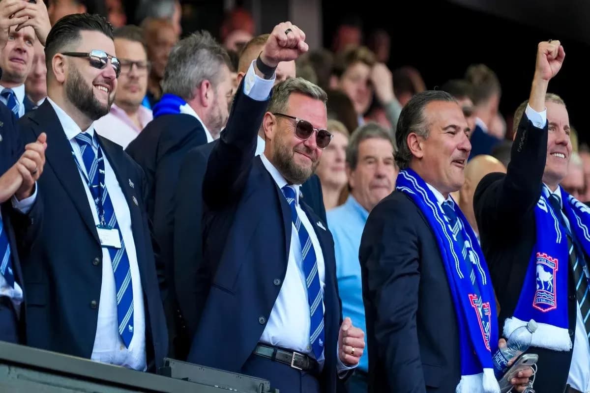 Group of men celebrating in a stadium suite