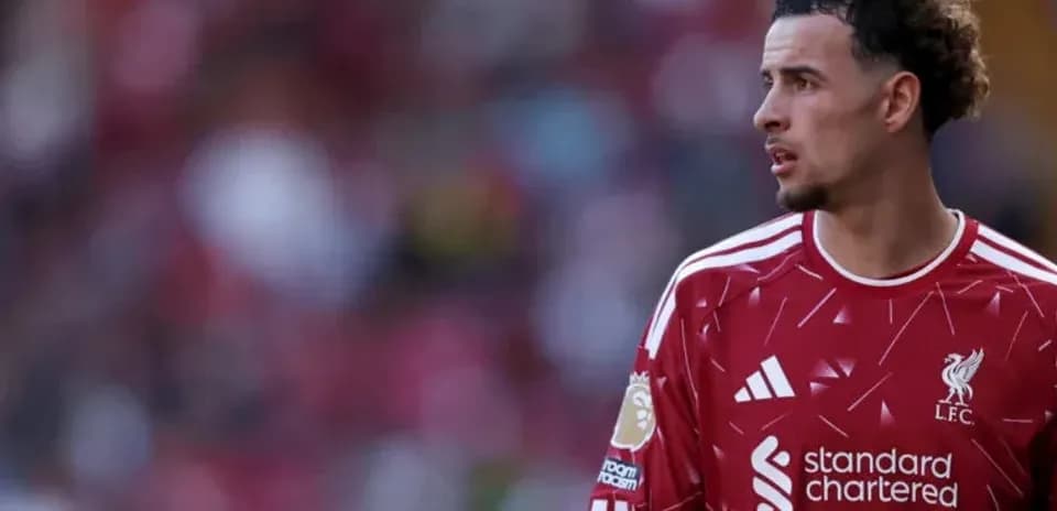 Liverpool player in red kit during match