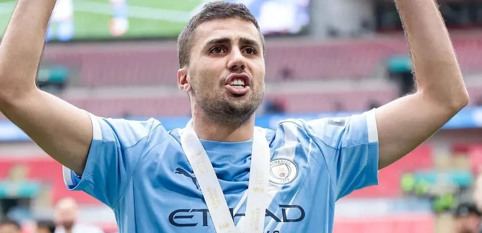 Player celebrating with medal after winning match