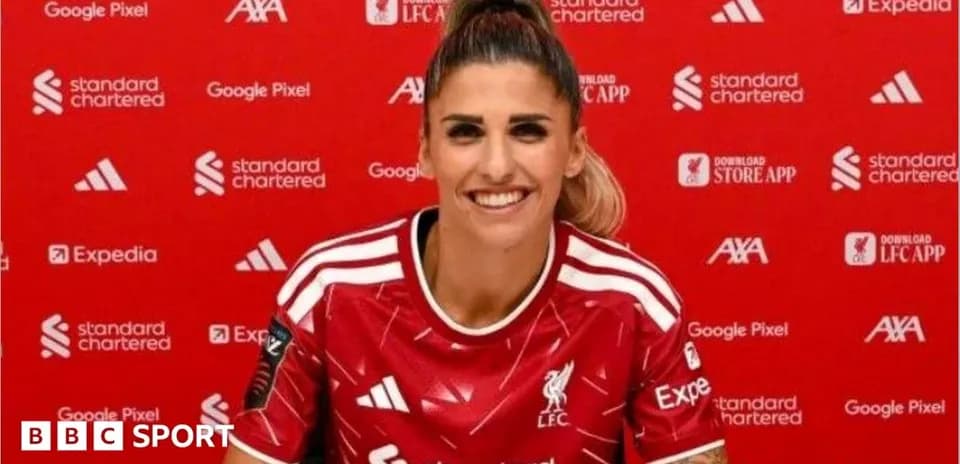 Player in Liverpool kit at press conference
