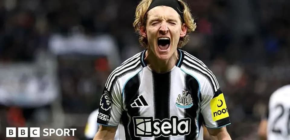 Player celebrating passionately in Newcastle kit