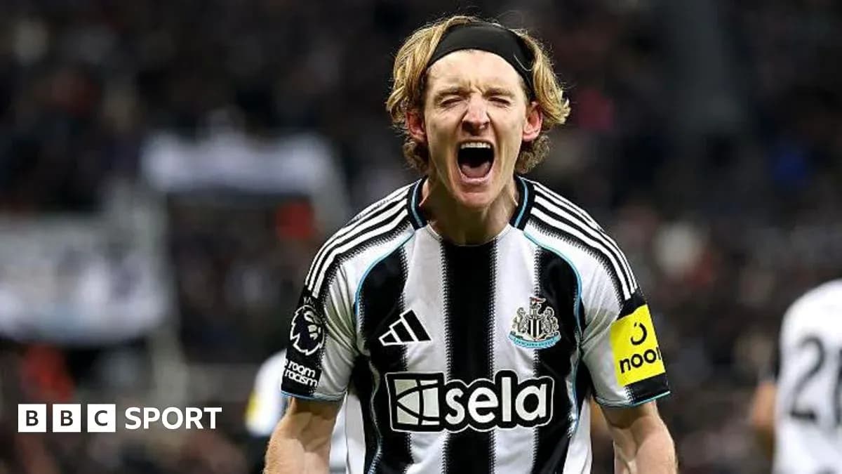 Player celebrating passionately in Newcastle kit