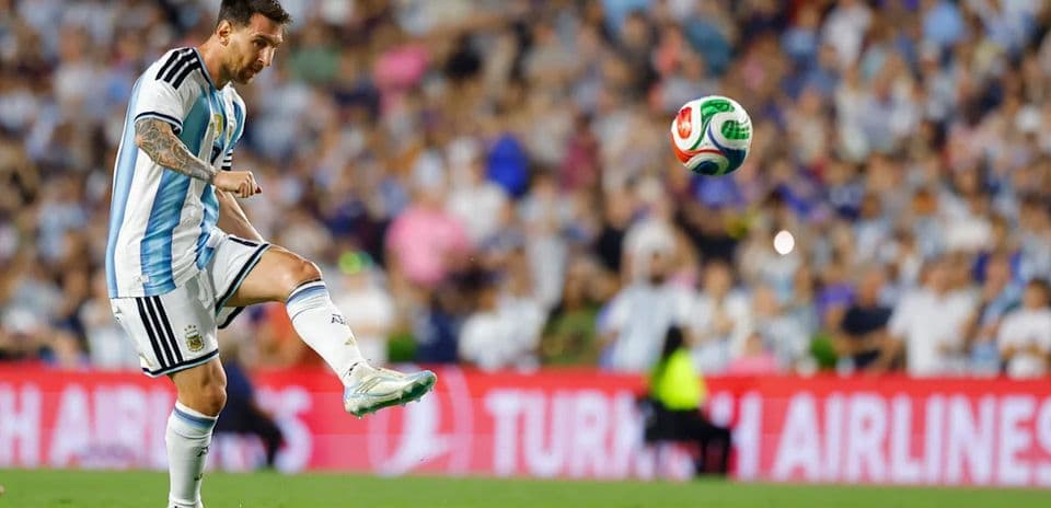 Player striking the ball during a football match