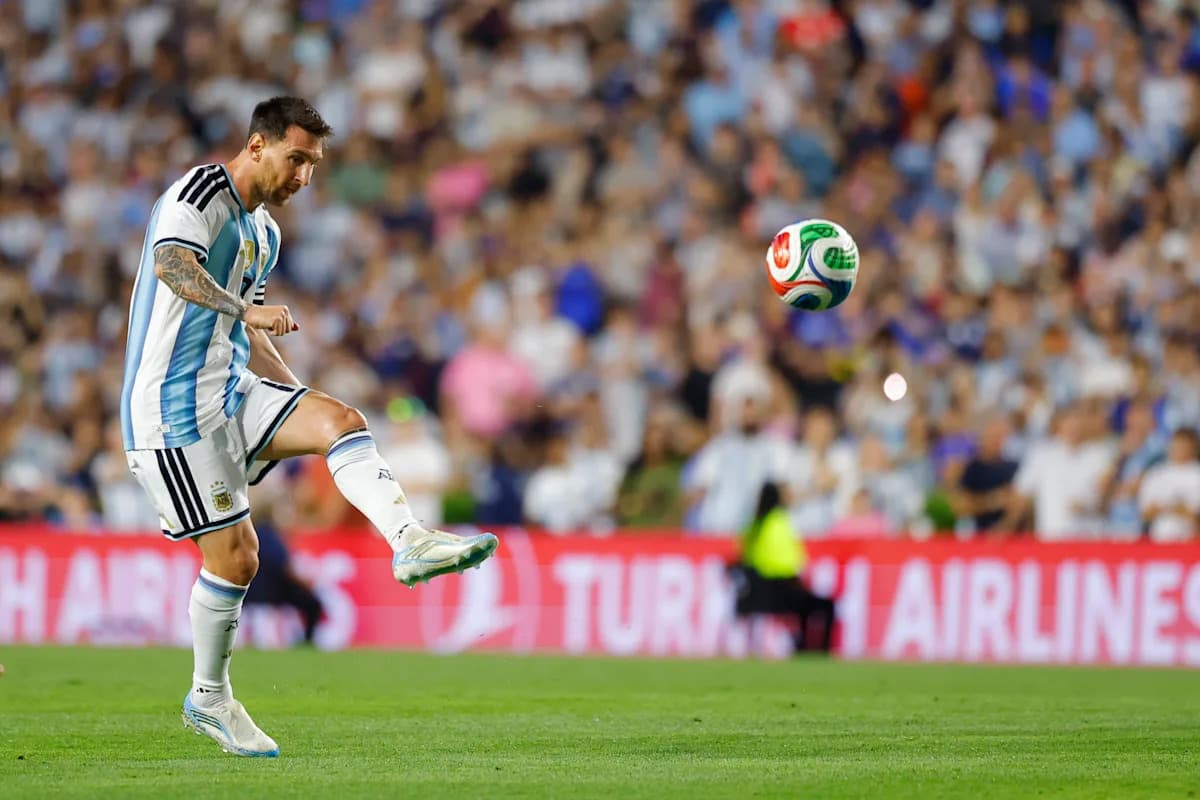 Player striking the ball during a football match