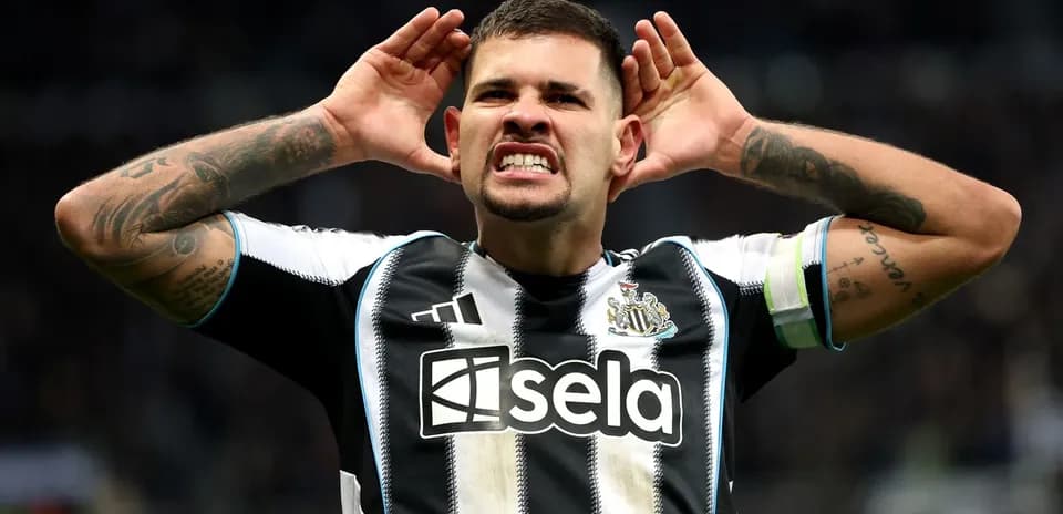 Player celebrating with hands on ears after goal