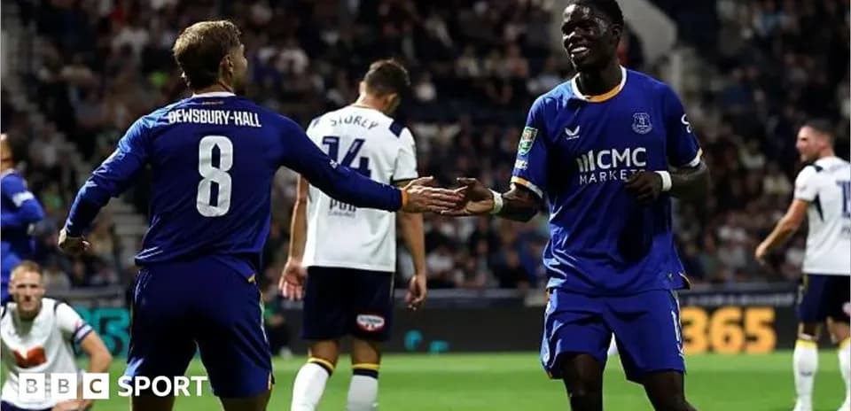 Two players celebrating a goal during a match