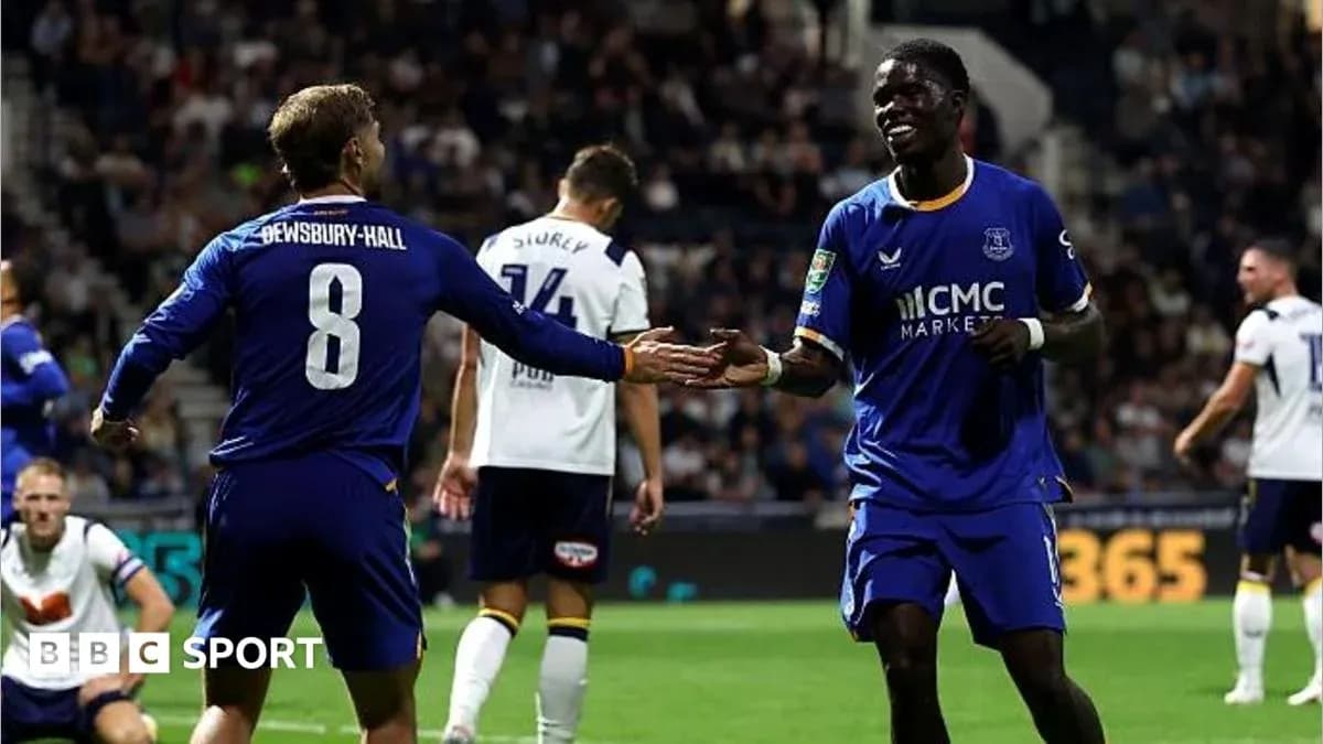 Two players celebrating a goal during a match