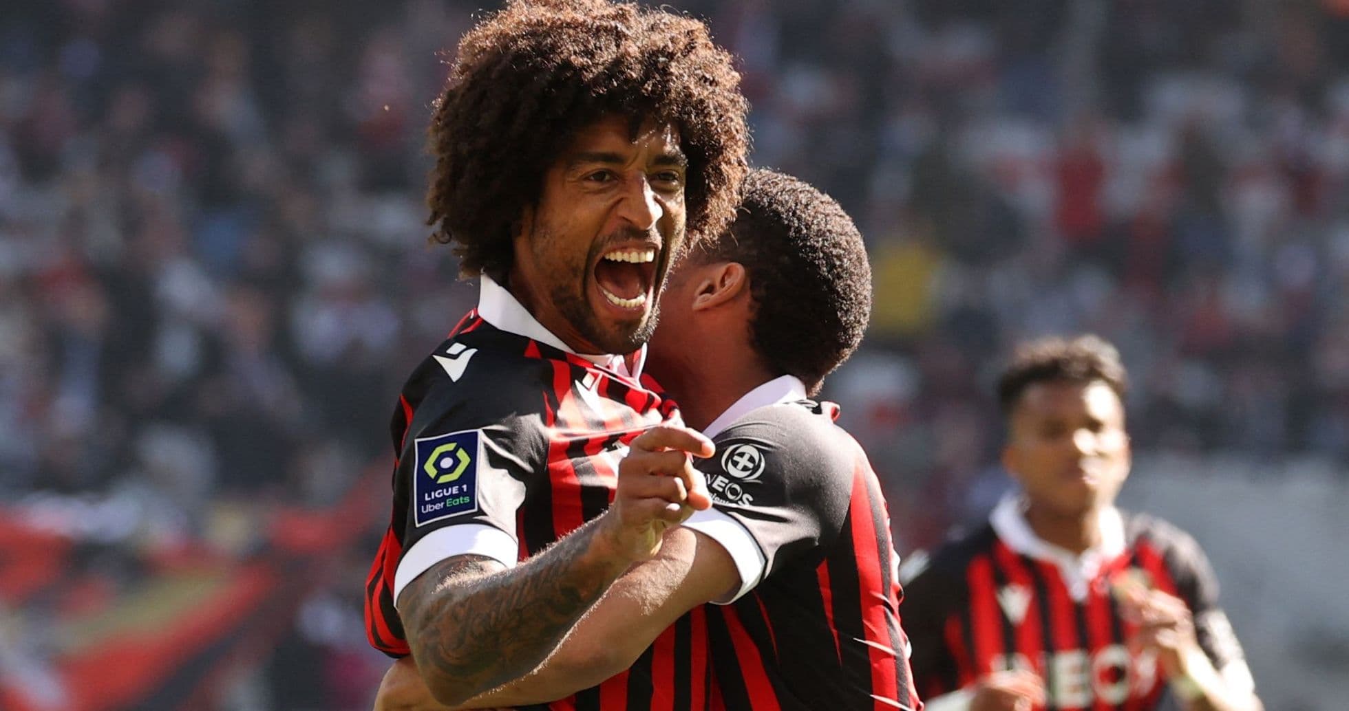 Player celebrating a goal with teammate during match