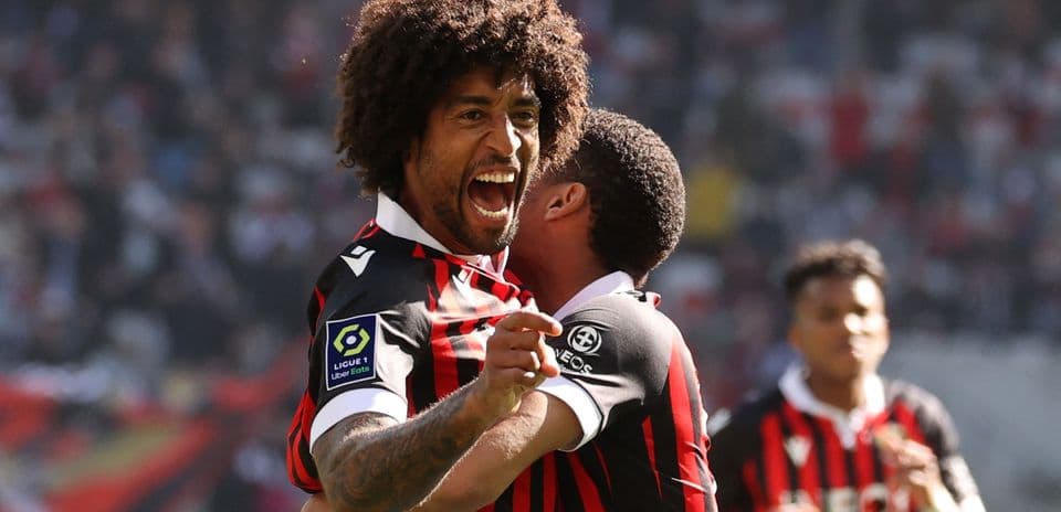 Player celebrating a goal with teammate during match