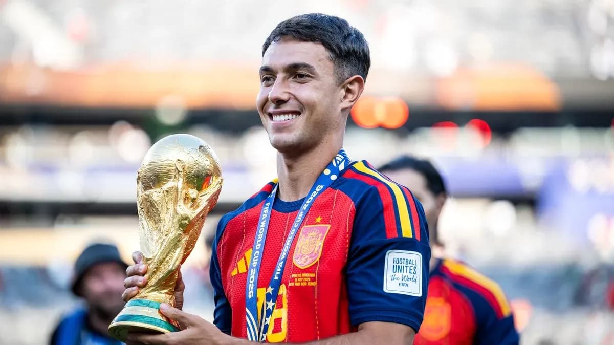 Player holding FIFA World Cup trophy in celebration