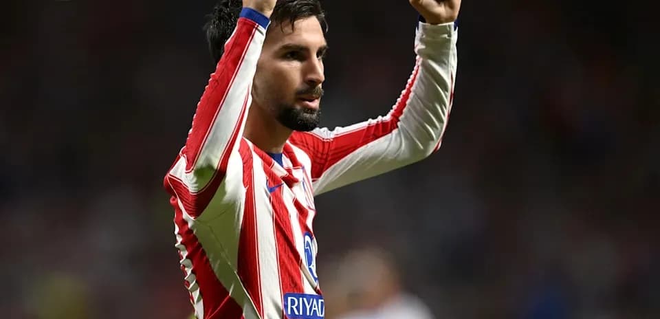 Player celebrating with raised fists on the field