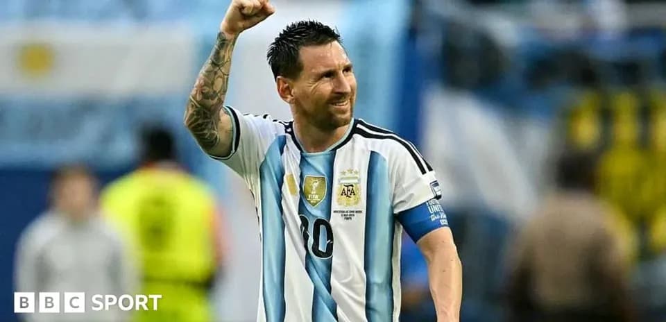 Lionel Messi celebrating with raised fist in jersey