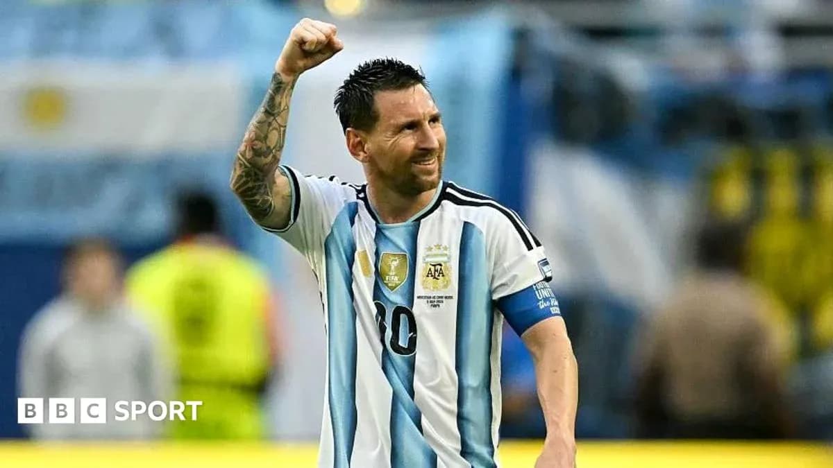 Lionel Messi celebrating with raised fist in jersey
