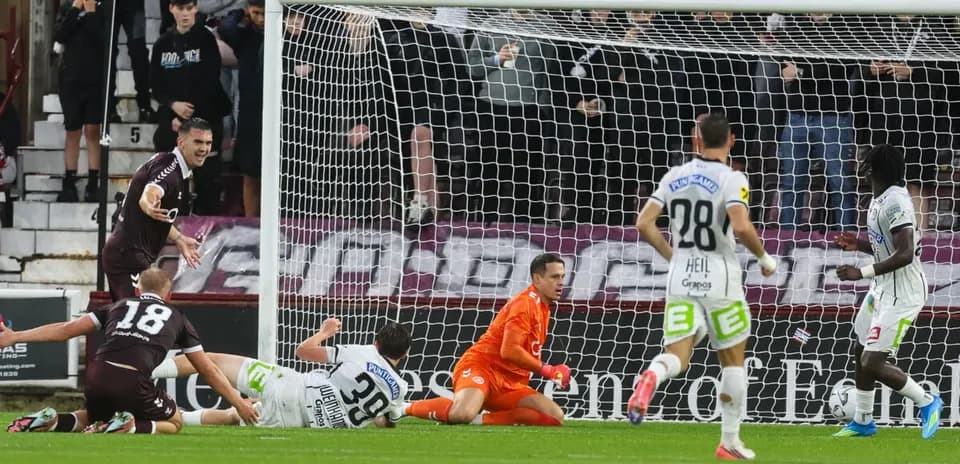 Heart Of Midlothian player celebrating near goal