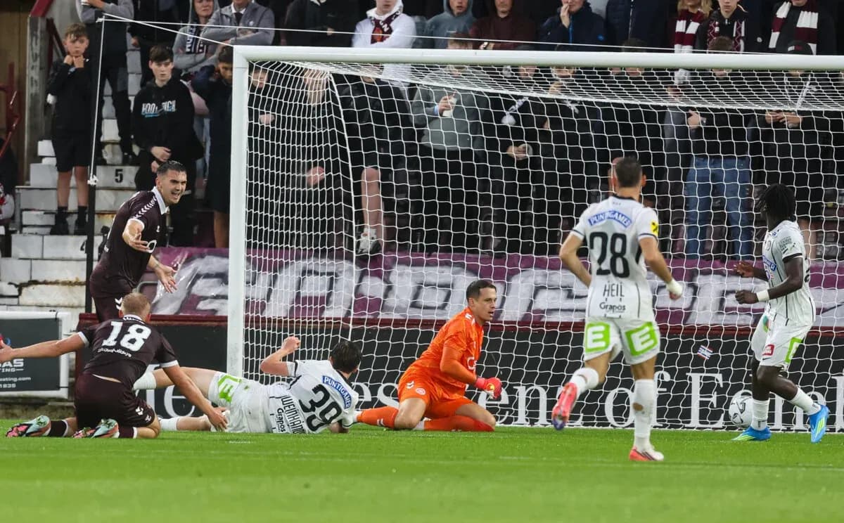 Heart Of Midlothian player celebrating near goal