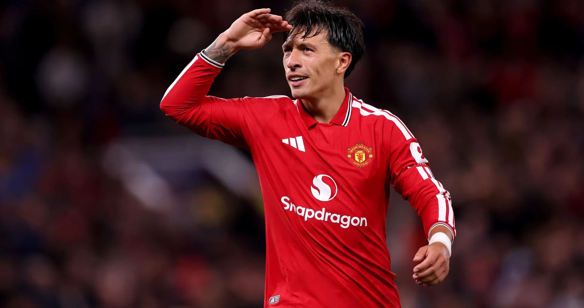 Player saluting fans during Manchester United match