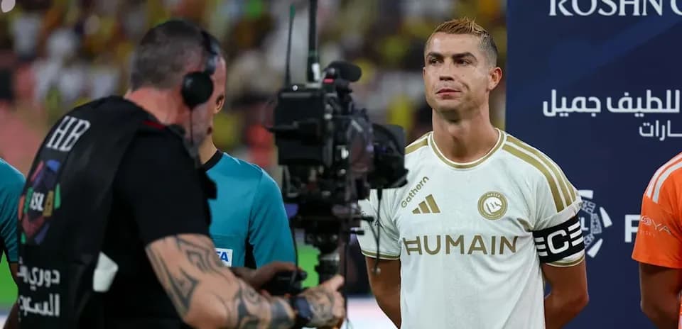 Player standing with camera crew before match