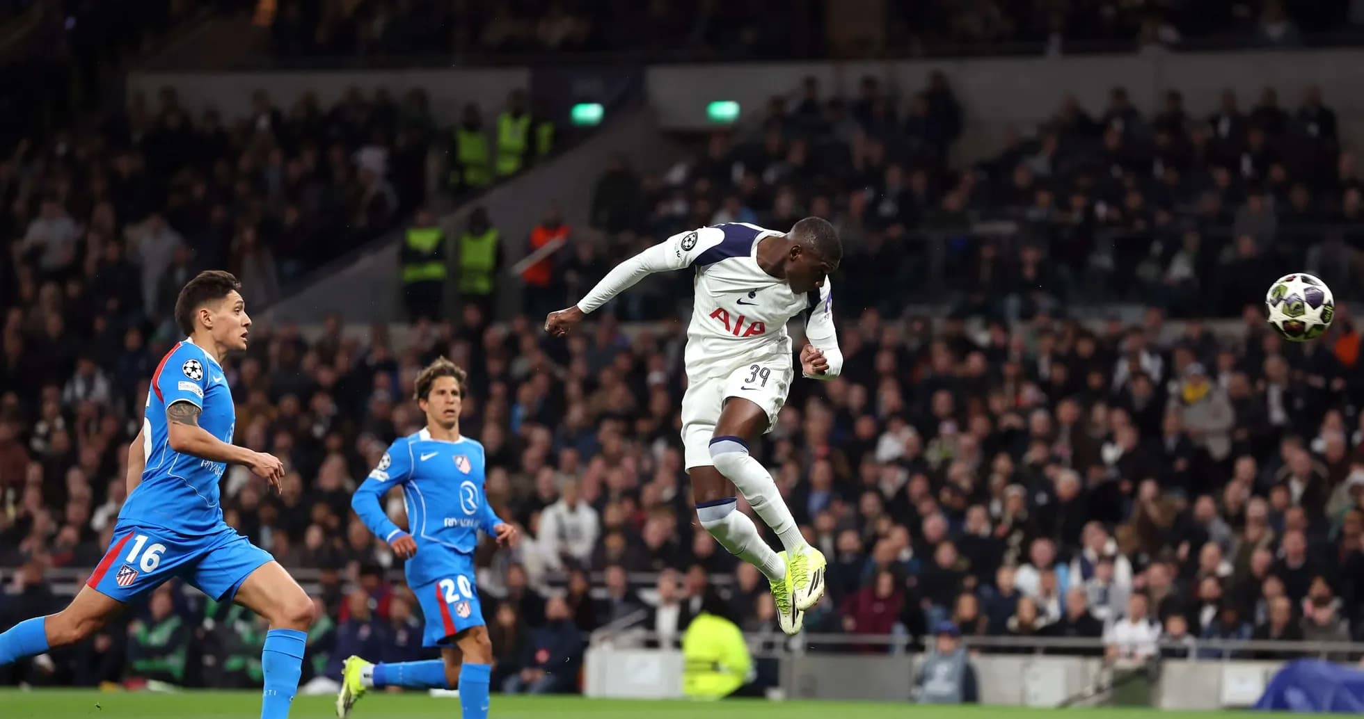 Player jumping to header during Champions League match