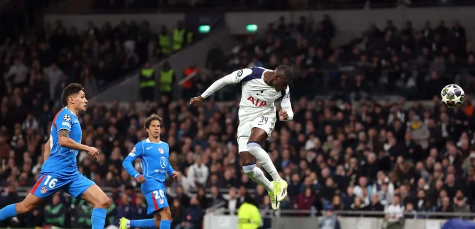 Player jumping to header during Champions League match