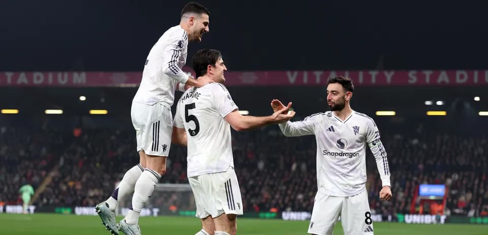 Players celebrating a goal during a match