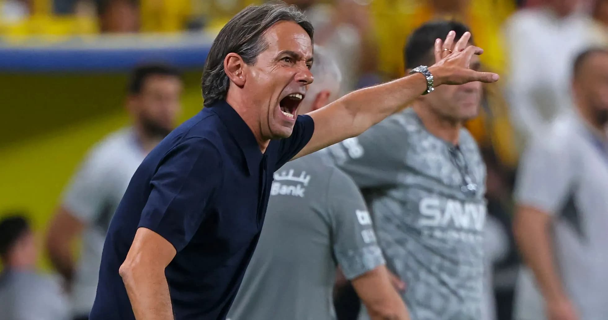 Coach directing players during a match from the sidelines